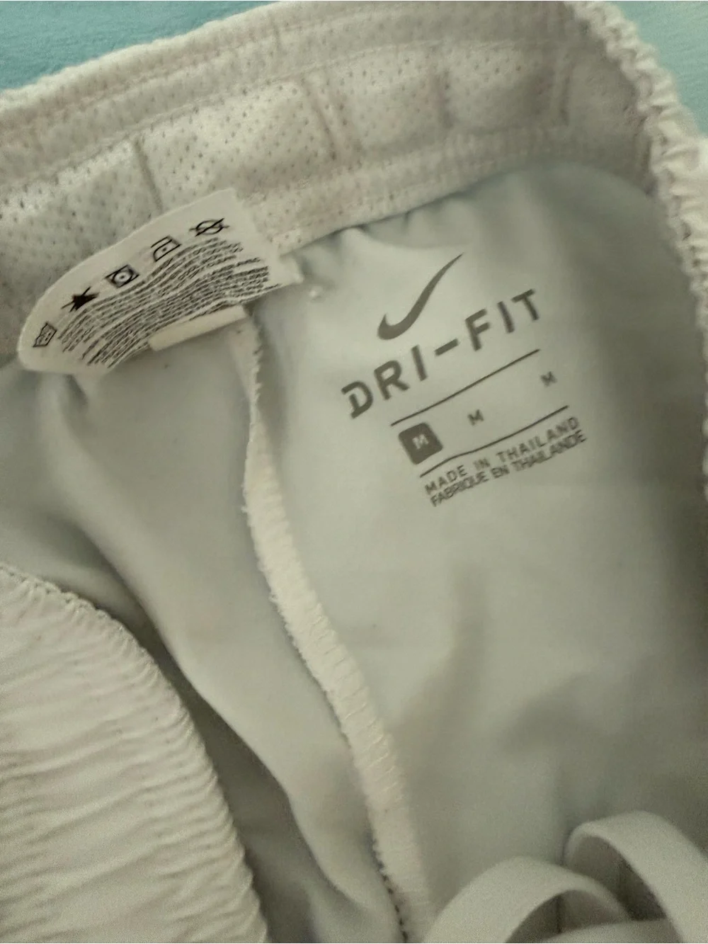 Nike Men's White Athletic Shorts with Black Side Panels